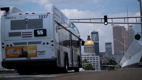 MARTA suspended bus fares and began boarding passengers at the rear door in March amid the coronavirus pandemic. But it will resume fares and regular boarding Monday. Ben Gray for the Atlanta Journal-Constitution
