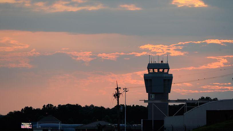 The sun sets behind the control tower at Dobbins Air Reserve Base on Aug. 1, 2014, in Marietta, Ga. David Tulis / AJC Special