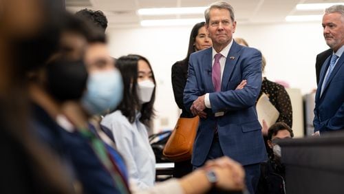 Gov. Brian Kemp observes a mock courtroom during a tour of the Alliance Academy for Innovation in Cumming on Monday, Jan. 31, 2022. (Ben Gray for The Atlanta Journal-Constitution)