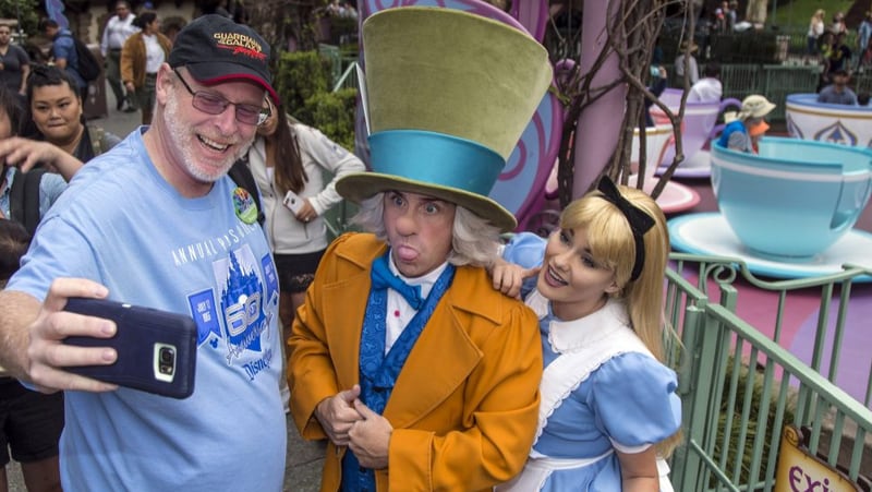 Huntington Beach resident Jeff Reitz, who has visited the parks of the Disneyland Resort every day since January 1, 2012, marked his 2,000th consecutive visit on Thursday. Here, Reitz snaps a selfie with The Mad Hatter and Alice after a teacup ride at the Mad Tea Party in Fantasyland at Disneyland during his 2,000th visit to the park.