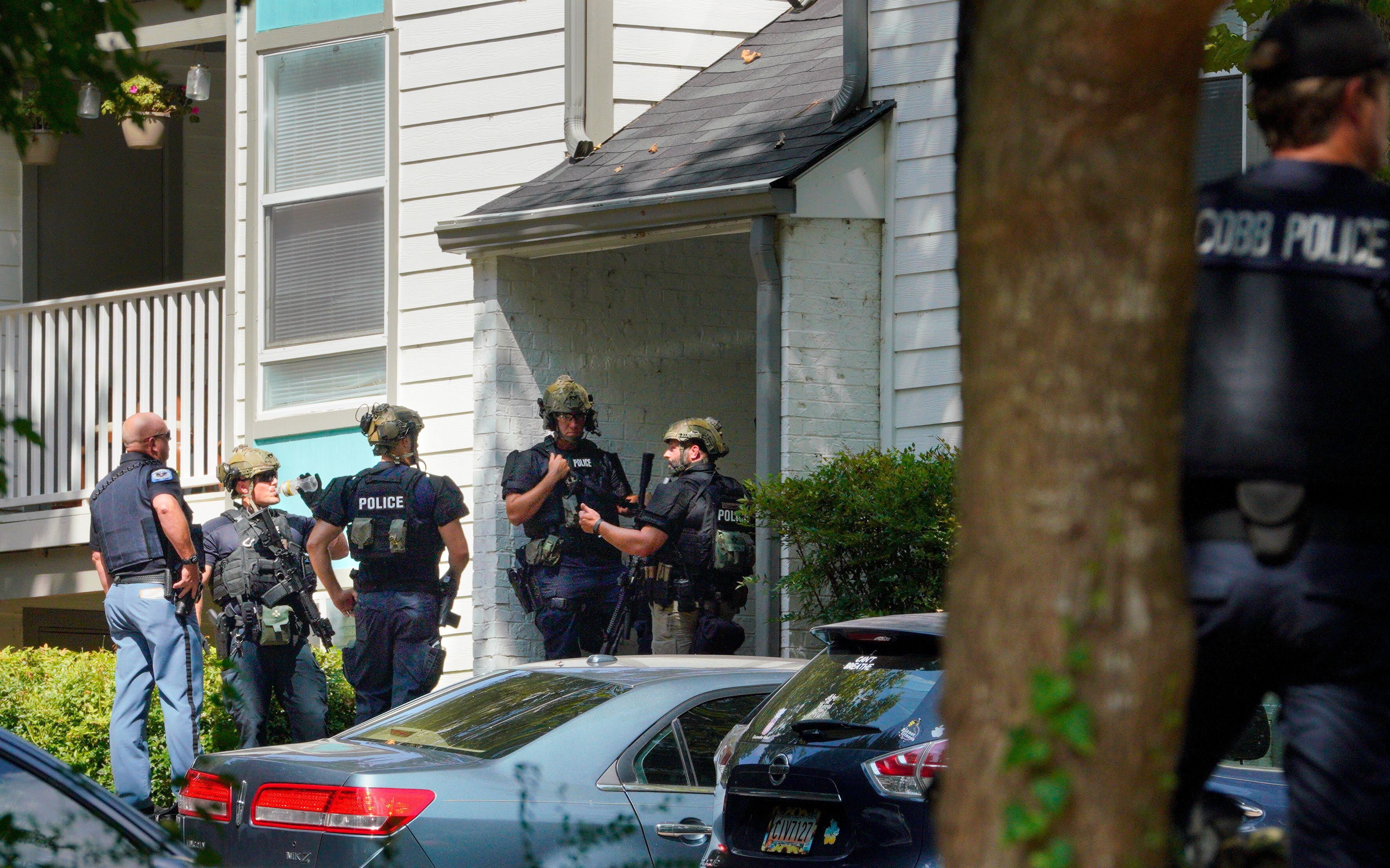 officials id man killed by swat during cobb apartment standoff