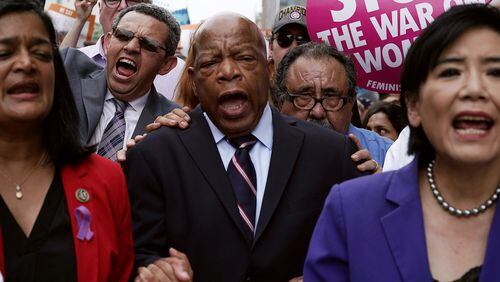 U.S. Rep. John Lewis (center), House Democratic colleagues and activists march to the headquarters of U.S. Customs and Border Protection during a protest on June 13, 2018 in Washington, D.C. (Photo by Alex Wong/Getty Images) *** BESTPIX ***