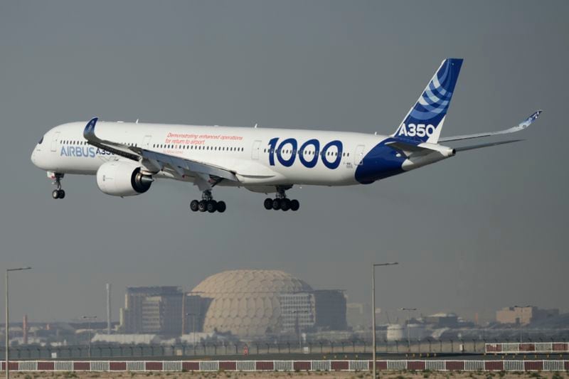 FILE - An Airbus A350 prepares to land at the Dubai Air Show, United Arab Emirates, Nov. 14, 2023. In the latest round of their decades-long battle for dominance in commercial aircraft, Europe's Airbus has established a clear sales lead over Boeing as the American company deals with the fallout from manufacturing troubles and ongoing safety concerns. (AP Photo/Kamran Jebreili, File)