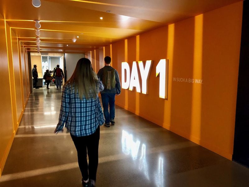 A corridor inside Amazon’s Day 1 tower at its headquarters in Seattle. Amazon’s growth has brought tens of thousands of jobs to Seattle’s downtown. (Scott Trubey / Scott.Trubey@ajc.com)