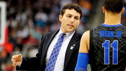 RALEIGH, NC - MARCH 23: Head coach Josh Pastner of the Memphis Tigers talks to Michael Dixon Jr. #11 in the first half against the Virginia Cavaliers during the third round of the 2014 NCAA Men's Basketball Tournament at PNC Arena on March 23, 2014 in Raleigh, North Carolina. (Photo by Grant Halverson/Getty Images)
