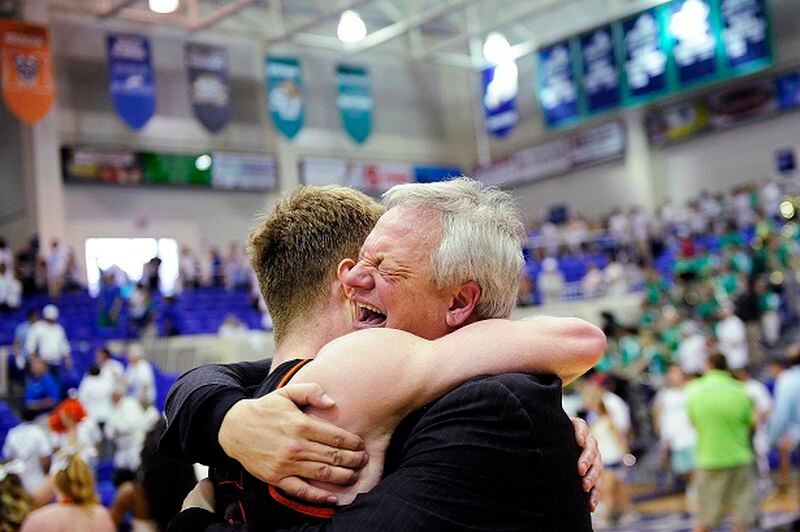 An emotional Mercer Men's Basketball Head Coach Bob Hoffman, right, hugs player Jakob Gollon after their win Sunday, March 9, 2014 at Alico Arena in Estero, Fla. The two faced off in the Atlantic Sun Men's Basketball Tournament championship. The Bears held off the Eagles 68-60 and earn an automatic bid to the NCAA tournament. (AP Photo/Naples Daily News, Corey Perrine) Dancin' Bears: Jakob Gollon and coach Bob Hoffman. (Corey Perrine/AP)