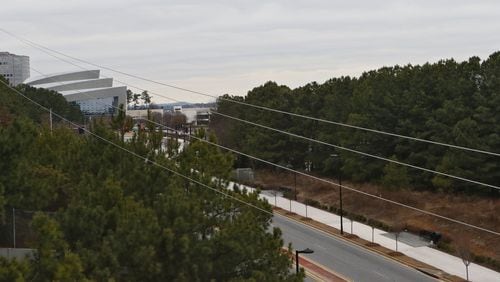 The property is at right, bordered by Cobb Galleria Parkway (in front). The Cobb Energy Center is visible at left. A proposed $100 million condo/office project in Cobb County has turned an otherwise routine bond approval by the local development authority into a battlefront over tax incentives and their cost to the school system. The project was delayed a month while the authority worked out differences with school board over lost tax revenue. BOB ANDRES / BANDRES@AJC.COM