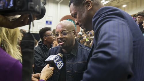 Actor Chris Tucker (right) and Rap mogul Jermaine Dupri (cener) answer questions from the media during a rally for gubernatorial candidate Stacey Abrams in Forbes Arena at Morehouse College, Friday, November 2, 2018.  (ALYSSA POINTER/ALYSSA.POINTER@AJC.COM)