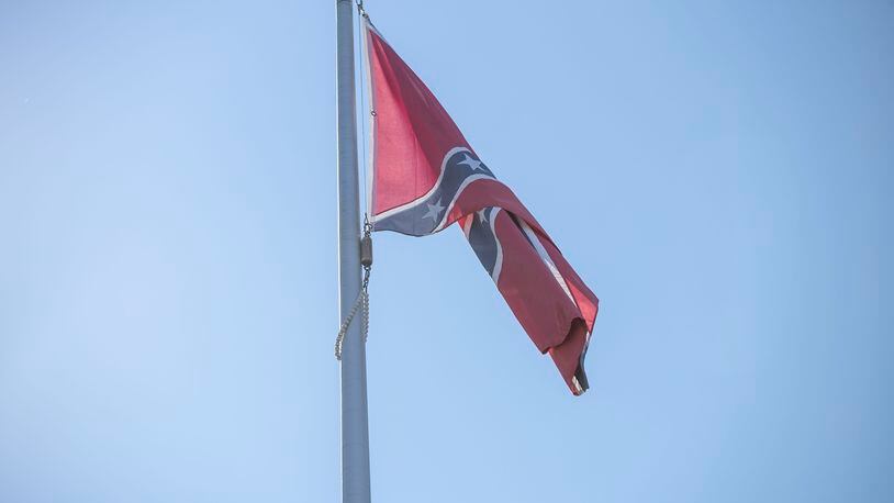 10/6/2020 - Stone Mountain, Georgia - A confederate flag waves on a pole at the flag terrace at the Stone Mountain walk-up trail in Stone Mountain, Tuesday, October 6, 2020. (Alyssa Pointer / Alyssa.Pointer@ajc.com)