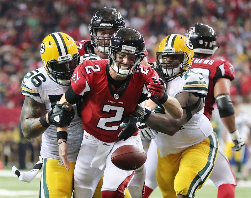 October 30, 2016 ATLANTA: Packers Julius Peppers (left) and Mike Daniels strip Falcons quarterback Matt Ryan of the ball on a two-point conversion attempt during the second quarter in an NFL football game on Sunday, Oct. 30, 2016, in Atlanta. Ryan was able to recover the fumble, but failed to score on the play. Curtis Compton /ccompton@ajc.com
