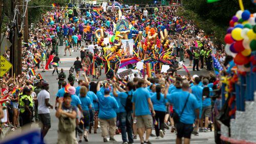 Spectators pack 10th street as the Atlanta Pride Parade heads toward Piedmont Park Sunday, Oct. 15, 2017.