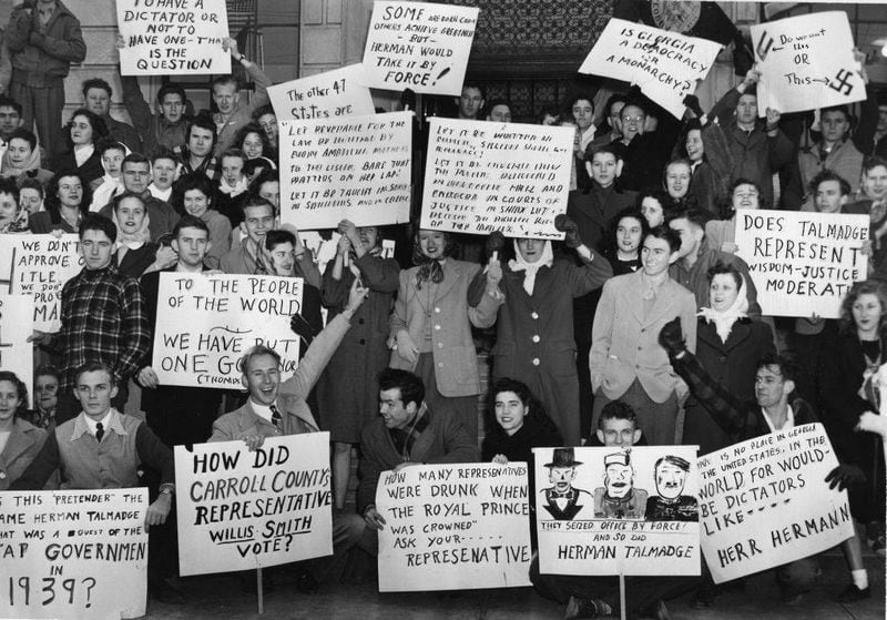1947 -- With placards that speak for themselves, West Georgia College students demonstrate at the town square in Carrollton against the Georgia Legislature's election of Herman Talmadge as the state's governor and "the relapse of Georgia after walking along the road to a progressive government." The 'Three Governors' controversy of the time stemmed from Governor Eugene Talmadge's death in 1946 and how "in the wake of Talmadge's death, his supporters proposed a plan that allowed the Georgia legislature to elect a governor in January 1947. When the General Assembly elected Talmadge's son Herman as governor, the newly elected lieutenant governor, Melvin Thompson, claimed the office of governor, and the outgoing governor, Ellis Arnall, refused to leave office. Eventually, the Georgia Supreme Court settled the controversy," ruling that Thompson was the rightful governor. -- Some text from the New Georgia Encyclopedia
