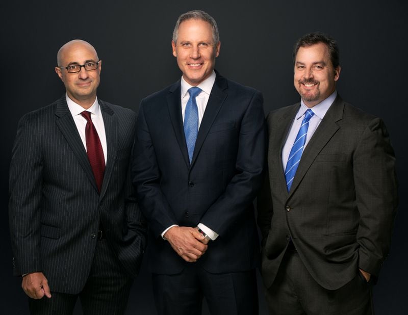 Former Court TV and CNN producers John Alleva  (left) and Scott Tufts (right) flanked by lead anchor Vinnie Politan. CREDIT: Katz