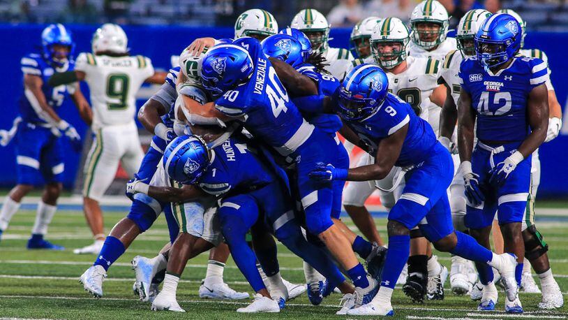 Jordan Veneziale (No. 40) leads the gang tackle against the Charlotte ball carrier in Georgia State's 20-9 win on Sept. 17, 2021.
