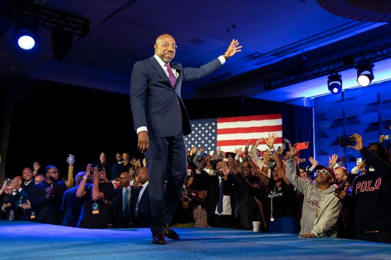 U.S. Sen. Raphael Warnock waves to supporters during his election night watch party in Atlanta. Warnock defeated Republican challenger Herschel Walker in a tight runoff election. (Nicole Craine/The New York Times)