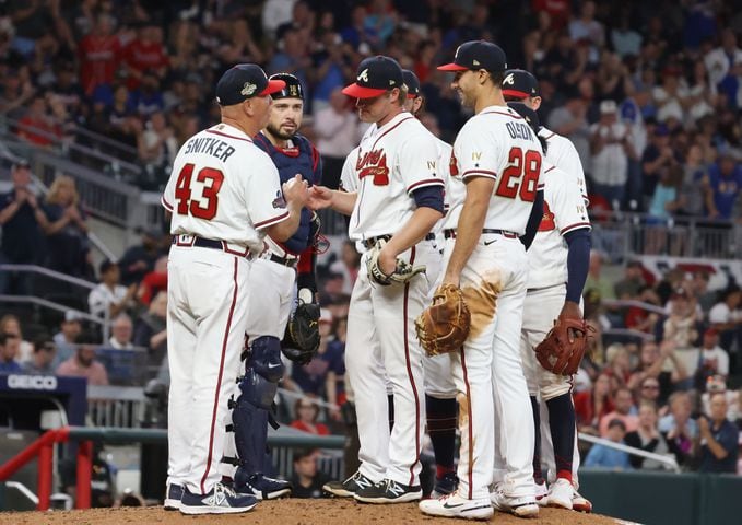 Atlanta Braves starting pitcher Bryce Elder (55) gives the ball to manager Brian Snikter as he is replaced during his MLB debut in a baseball game against the Washington Nationals. Miguel Martinez/miguel.martinezjimenez@ajc.com