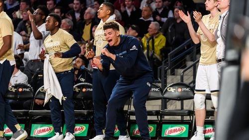 Georgia Tech forward Jordan Usher (middle, in navy sweats) has a body like a football player and an intensity level comparable to Tech point guard Jose Alvarado, strength-and-conditioning coach Dan Taylor said. "He's like a 6-foot-5, 225-pound version of Jose, is the best way I can describe it," Taylor said. (Danny Karnik/Georgia Tech Athletics)