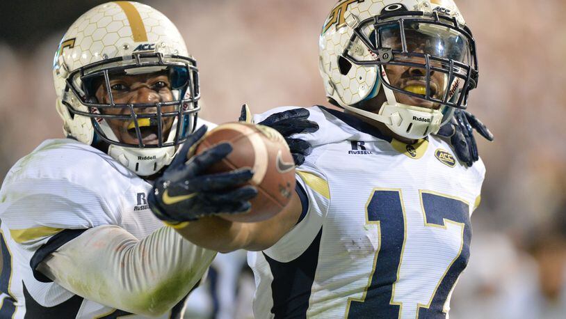 Georgia Tech defensive back Lance Austin (17) is celebrated by twin brother and defensive back Lawrence Austin after he scored a touchdown at the end of the fourth quarter at Bobby Dodd Stadium on Saturday, October 24, 2015. Georgia Tech won 22 - 16 over Florida State. HYOSUB SHIN / HSHIN@AJC.COM
