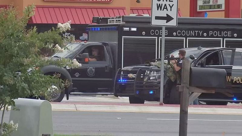 Cobb County police and other law enforcement agencies surrounded the Wells Fargo bank on Windy Hill Road. (Credit: Channel 2 Action News)