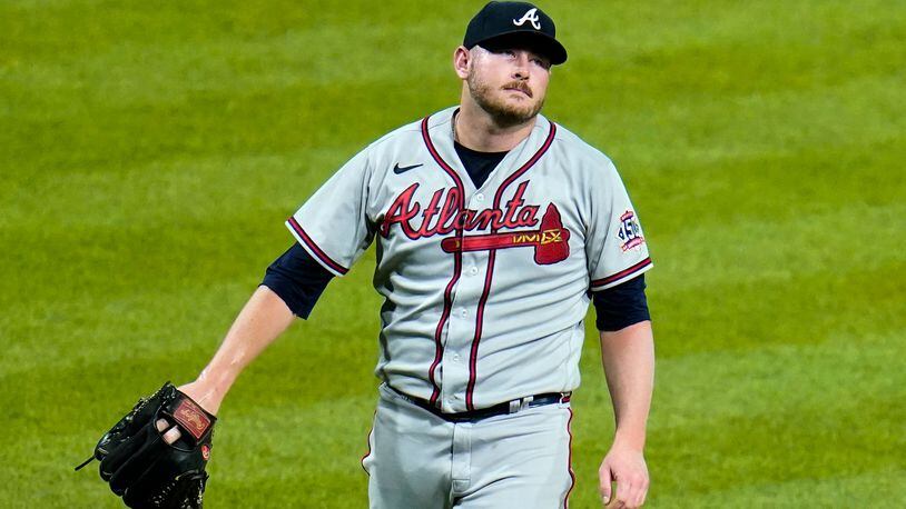 Atlanta Braves relief pitcher Tyler Matzek walks off the mound after walking Pittsburgh Pirates' Bryan Reynolds with bases loaded in the ninth inning of a baseball game in Pittsburgh, Tuesday, July 6, 2021. The Pirates won 2-1. (AP Photo/Gene J. Puskar)