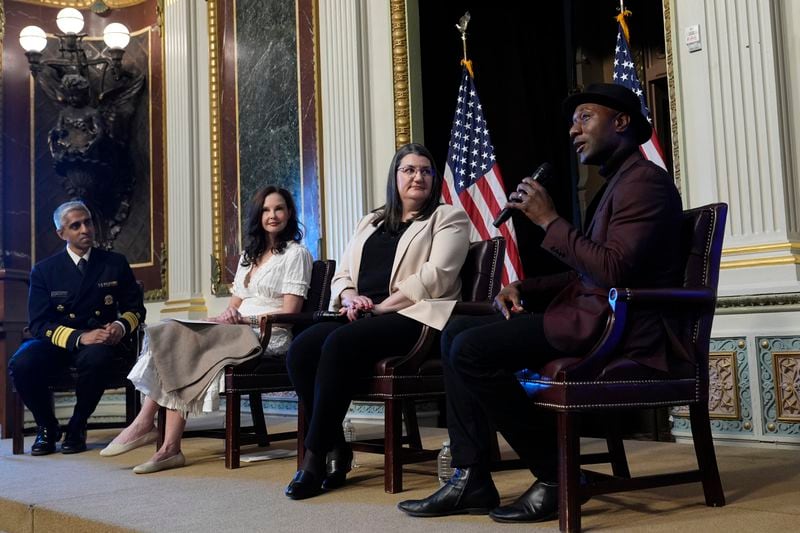 Singer-songwriter Aloe Blacc speaks, right, speaks during an event on the White House complex in Washington, Tuesday, April 23, 2024, with notable suicide prevention advocates. He is joined by, from left, Surgeon General Dr. Vivek Murthy, Ashley Judd, and Shelby Rowe, Executive Director of the Suicide Prevention Research Center. The White House held the event on the day they released the 2024 National Strategy for Suicide Prevention to highlight efforts to tackle the mental health crisis and beat the overdose crisis. (AP Photo/Susan Walsh)