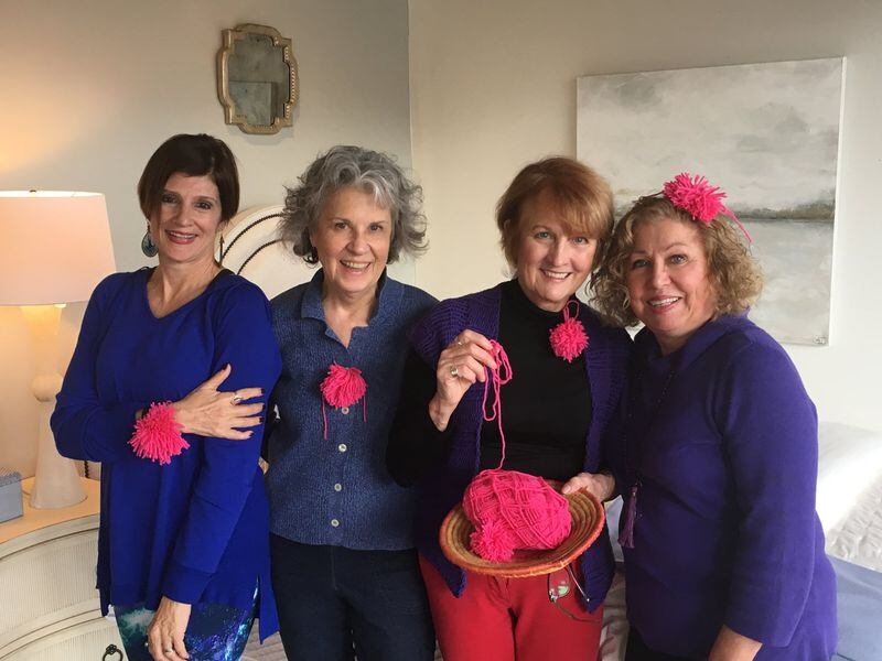 Teresa Libbey (from left), Marcia Partin, Pat Harris and Beverly Molander, all of Atlanta, show off pink pompoms they made to wear during the Women’s March on Washington on Saturday. CONTRIBUTED