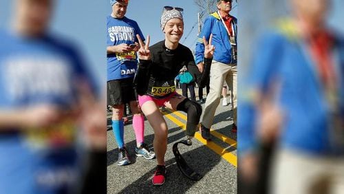 In this April 18, 2016, file photo, Boston Marathon bombing survivor Adrianne Haslet poses at the start line in Hopkinton, Mass., before running in the 120th Boston Marathon. Haslet, who lost her left leg in the 2013 Marathon bombing, is in the hospital after being struck by a car while in a crosswalk in Boston.
