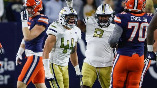 Linebacker Kyle Efford (44) celebrates with teammates after a stop during the first half of an NCAA college football game between Georgia Tech and Syracuse in Atlanta on Saturday, Nov. 18, 2023.   (Bob Andres for the Atlanta Journal Constitution)
