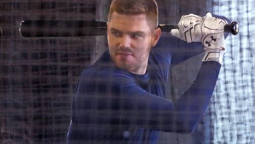 Braves Freddie Freeman takes his cuts at the opening of spring training. (Curtis Compton/ccompton@ajc.com)