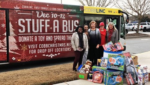 From now through Dec. 12, donations of food and toys are being collected for local children in need at 18 Stuff A Bus stops. (Courtesy of Cobb County)