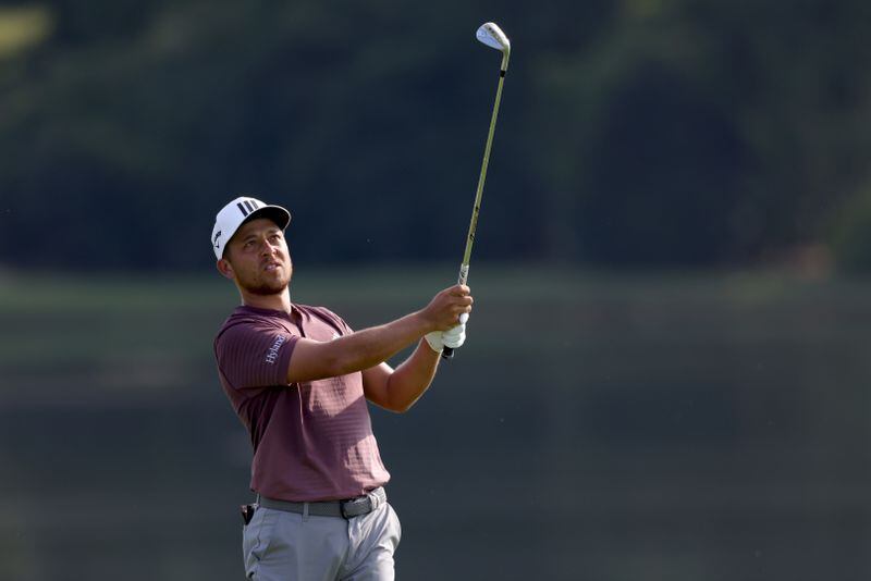 Xander Schauffele hits his second shot on the eighth fairway during the third round of the Tour Championship at East Lake Golf Club, Saturday, August 27, 2022, in Atlanta. (Jason Getz / Jason.Getz@ajc.com)