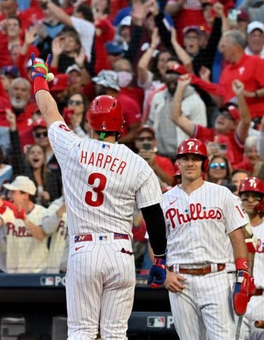 Philadelphia Phillies designated hitter Bryce Harper (3) reacts after an RBI home run against the Atlanta Braves during the third inning of game three of the National League Division Series at Citizens Bank Park in Philadelphia on Friday, October 14, 2022. (Hyosub Shin / Hyosub.Shin@ajc.com)
