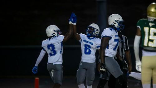 Newton County players celebrate a touchdown during Friday's game against Grayson. (Photo/Jenn Finch)