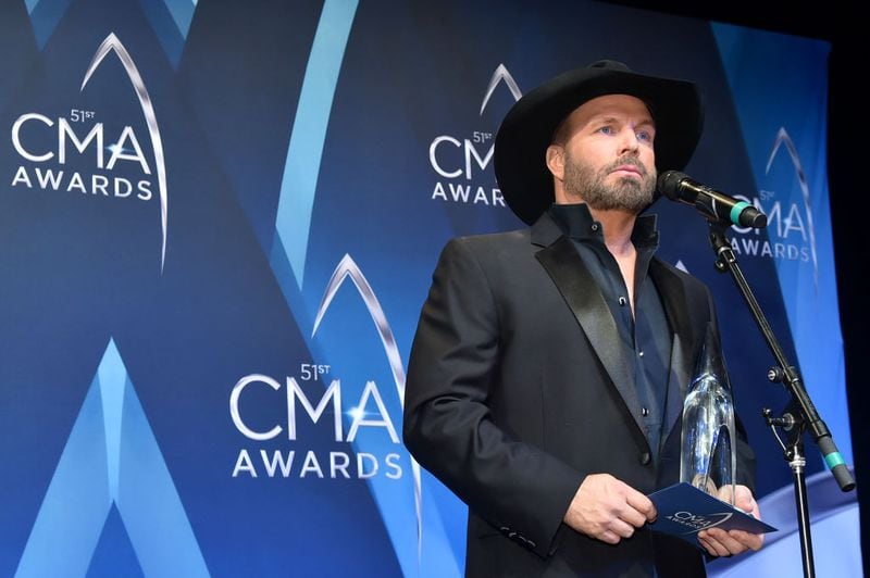 NASHVILLE, TN - NOVEMBER 08:  Garth Brooks poses with Entertainer of the year award in the press room at the 51st annual CMA Awards at the Bridgestone Arena on November 8, 2017 in Nashville, Tennessee.  (Photo by Mike Coppola/Getty Images)