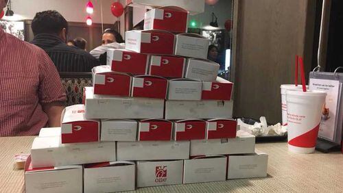 Folks ate some chicken nuggets (about 4,500) at the Chick-fil-A on Roswell Road in Marietta on all-you-can-eat night, Tuesday, Nov. 14, 2017.
