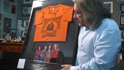 Peter Conlon, president of Live Nation Atlanta, talks about the International Pop Festival. Conlon was a mentee of concert promoter Alex Cooley, a producer of the 1969 concert the weekend of July 4. Peter has a lot of memorabilia from the event, including this framed T-shirt from the concert above a picture of Led Zeppelin. Photo: RYON HORNE/RHORNE@AJC.COM