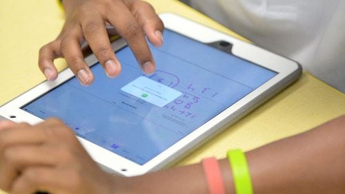 Fulton County Schools plans to buy more iPads for its youngest students to use in classrooms. KENT D. JOHNSON/ AJC FILE PHOTO