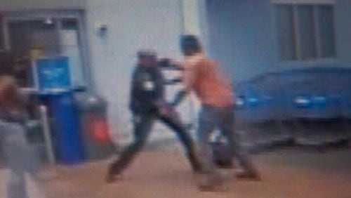 Video surveillance from a Walmart shows an off-duty police officer beating a customer.