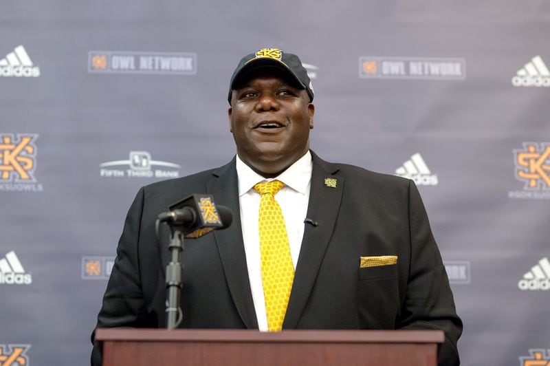 Milton Overton models his new wardrobe during his introductory press conference as Kennesaw State's incoming athletic director. (Kyle Hess/Kennesaw State Athletics)