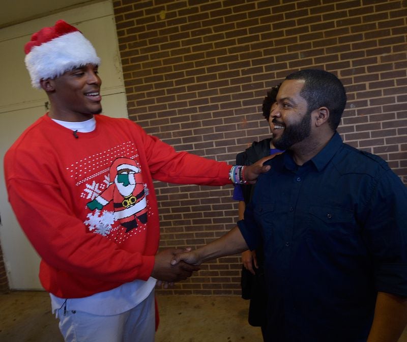 Cam Newton and Ice Cube at Harding High School in Charlotte. Photo by Grant Halverson/Getty Images for Universal Pictures