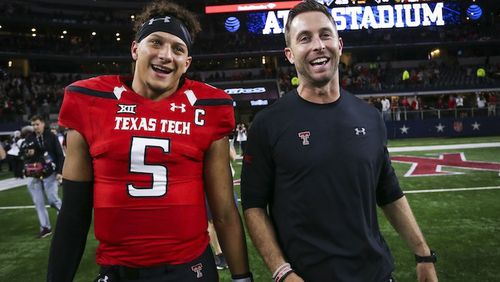 Quarterback Patrick Mahomes II (5) and Texas Tech head coach Kliff Kingsbury walk off the field after after a 54-35 win against Baylor at AT&T Stadium in Arlington, Texas, on November 25, 2016. (Richard W. Rodriguez/Fort Worth Star-Telegram/TNS)