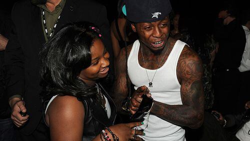 LOS ANGELES, CA - JUNE 26: Reginae Carter (L) and rapper Lil Wayne in the audience during the BET Awards '11 held at the Shrine Auditorium on June 26, 2011 in Los Angeles, California. (Photo by Kevin Winter/Getty Images)