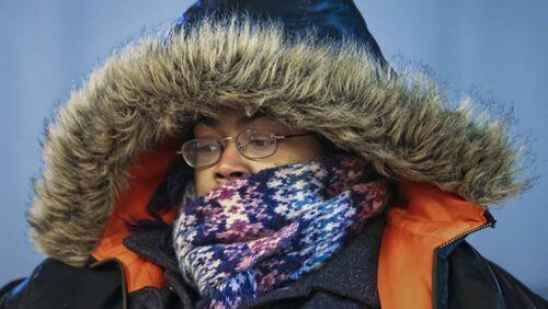 Yoshiaka Norris was bundled for an arctic expedition Friday as she headed into the Five Points MARTA Station.