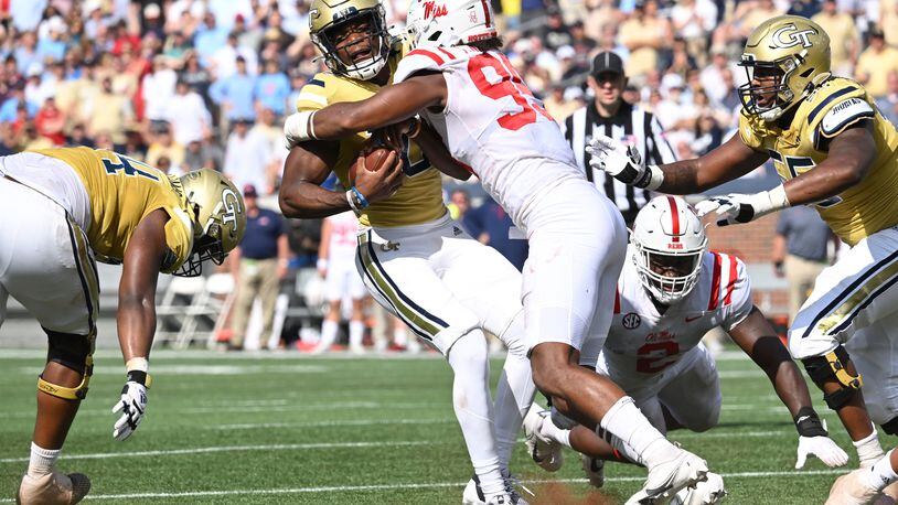 Georgia Tech quarterback Jeff Sims is brought down by Ole Miss defensive end Tavius Robinson during the first half Saturday in Atlanta. (Hyosub Shin/The Atlanta Journal-Constitution/TNS)