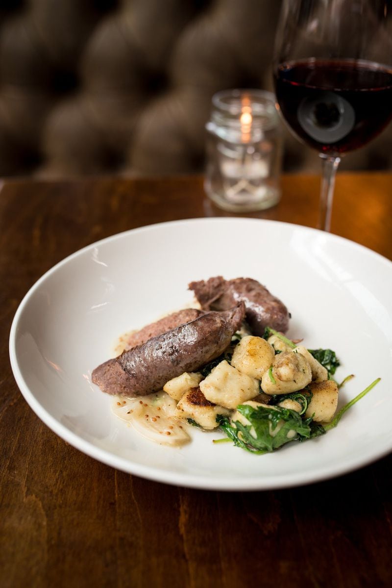 Garlicky greens and crisp-edged, pillowy gnocchi are the best part of the bangers + mash at Hampton + Hudson. CONTRIBUTED BY MIA YAKEL
