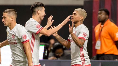 Atlanta United's Josef Martinez is congratulated after scoring a goal against New England on Wednesday at Mercedes-Benz Stadium.  (Eric Rossitch / Atlanta United)