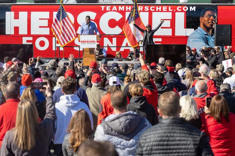 U.S. Senate hopeful Herschel Walker talks to the crowd during a Smyrna rally with Gov. Brian Kemp Saturday, November 19, 2022.   (Steve Schaefer/steve.schaefer@ajc.com)