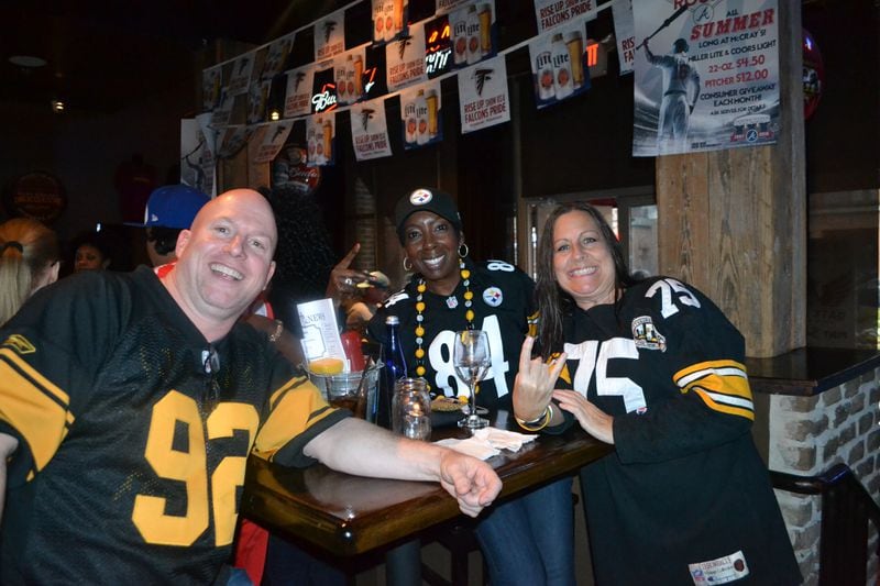  Steelers fans Doug Powers, Shikina Glauden and Lori Clearwater showed up early for AFC Championship to watch the Falcons in the NFC Championship.
