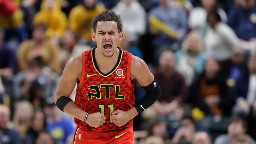 Hawks' Trae Young (11) reacts after hitting a shot during the second half of an NBA basketball game against the Indiana Pacers, Friday, Nov. 29, 2019, in Indianapolis. Indiana won 105-104 in overtime. (AP Photo/Darron Cummings)