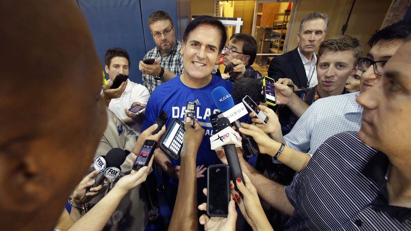 Dallas Mavericks owner Mark Cuban speaks to reporters during an NBA basketball media day in Dallas, Monday, Sept. 29, 2014. (AP Photo/LM Otero)
